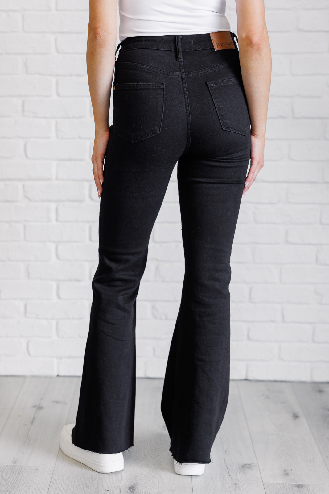 Etta High Rise Tummy Control Flare Jeans in Black