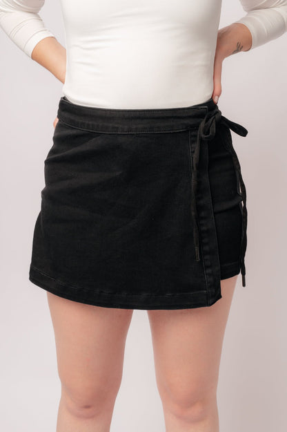Bentli High Rise Side Tie Denim Skort in Black - Driftwood Boutique