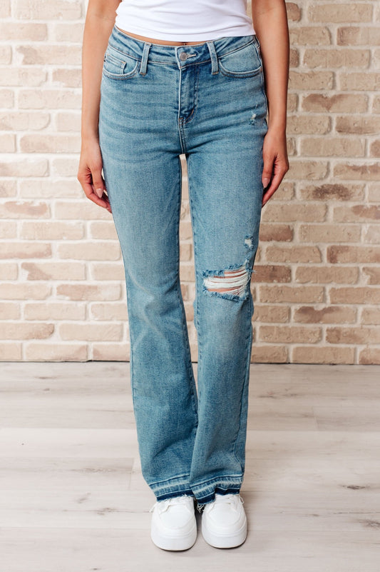 Isla Mid Rise Distressed Released Hem Bootcut Jeans - Driftwood Boutique