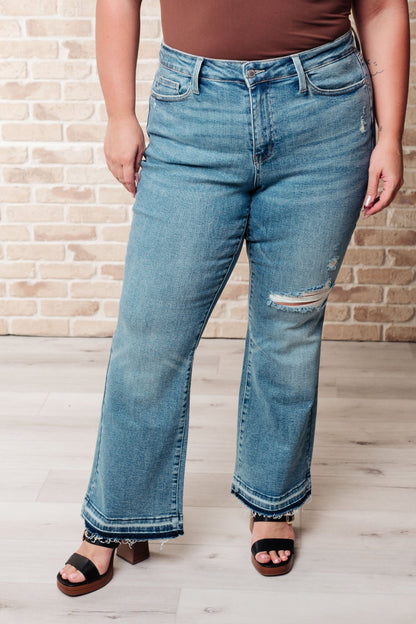 Isla Mid Rise Distressed Released Hem Bootcut Jeans - Driftwood Boutique